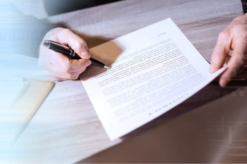 Review the terms of the existing strata management contract